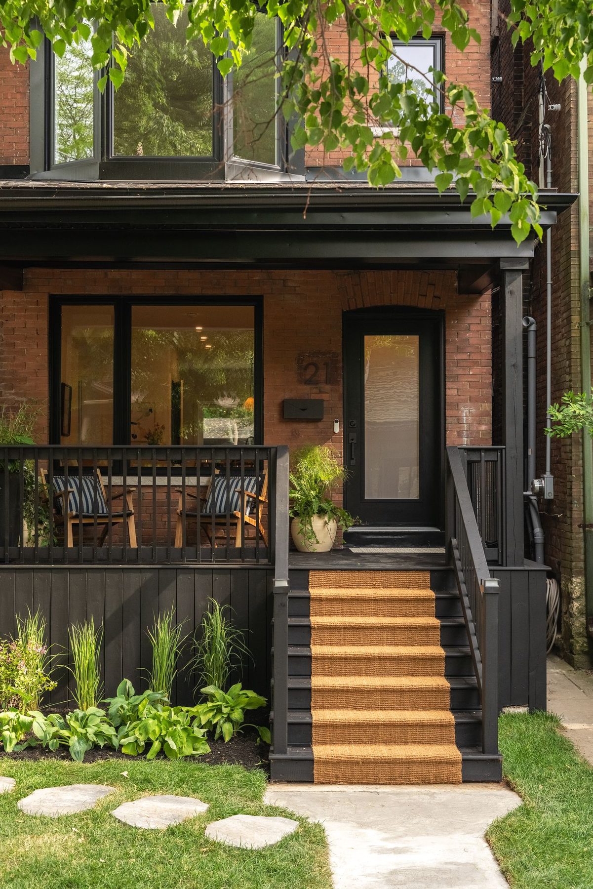 Renovated Toronto home's restored brick façade and front porch